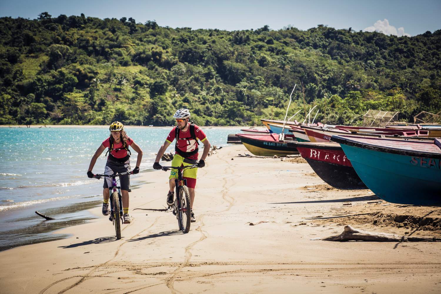 two bikers on a Jamaican beach