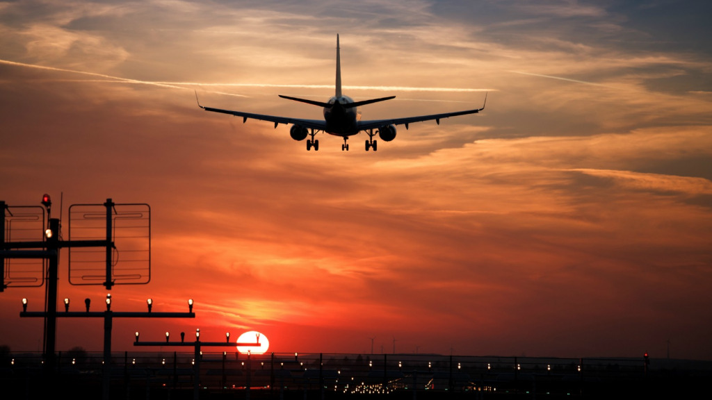 aircraft in the air at sunset