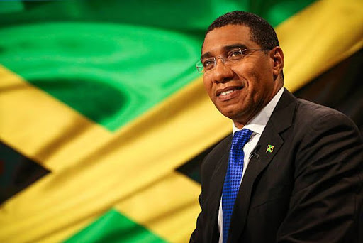 Andrew Holness and the Jamaican flag
