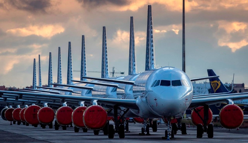 airliners in a row on tarmac