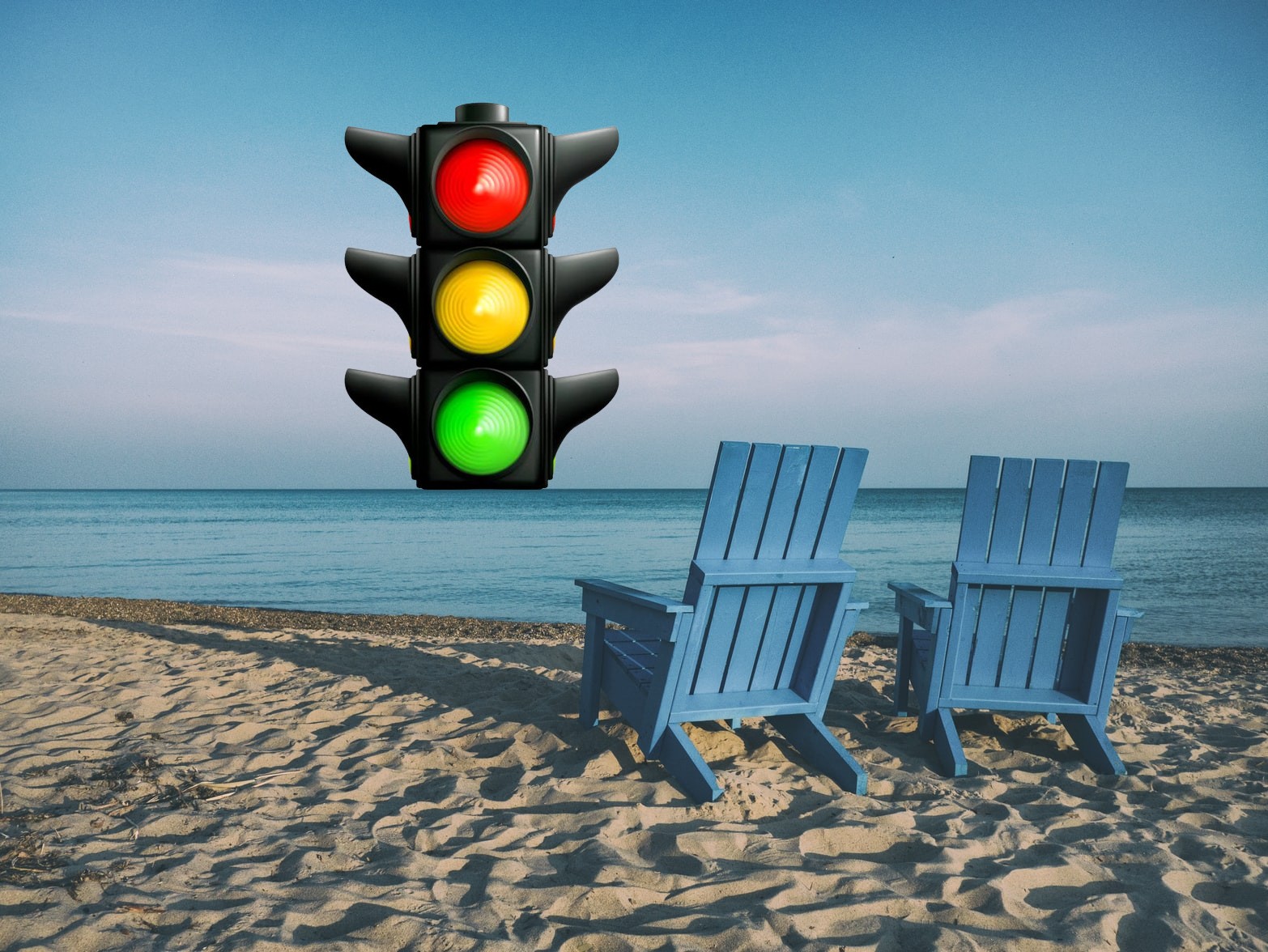 beach, two beach chairs and a traffic light