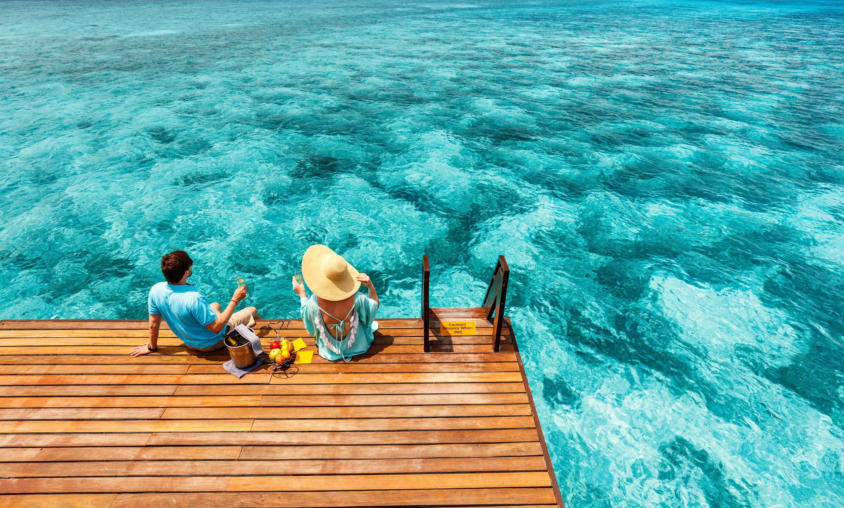 couples on a pier