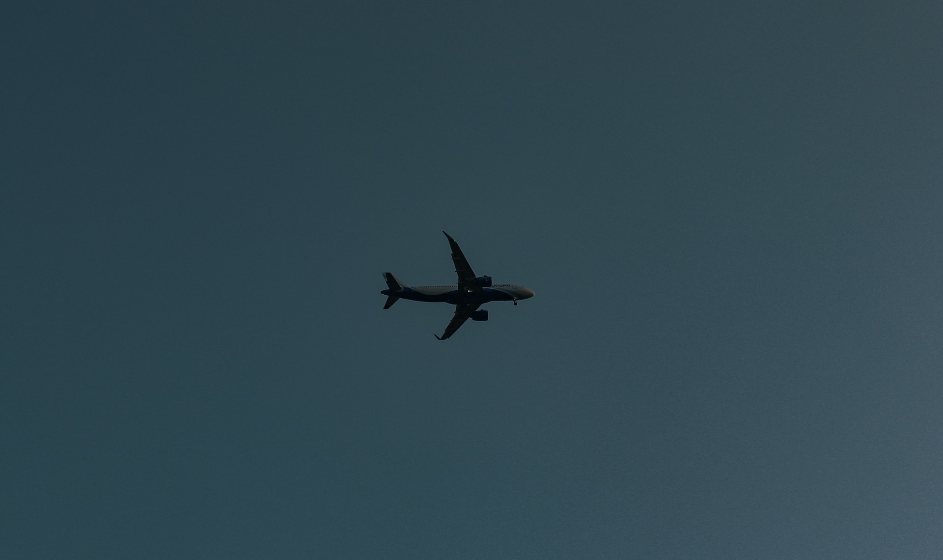airplane on a dark background up in the air