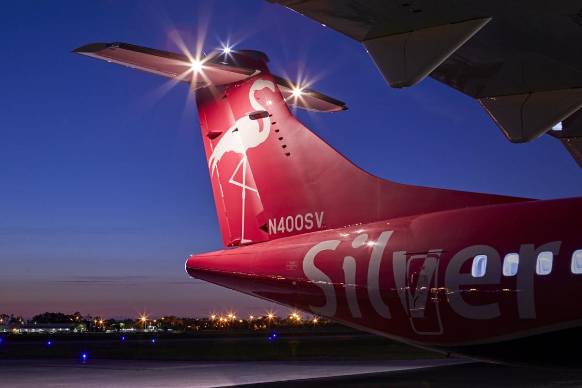 Silver Airways plane tail at night
