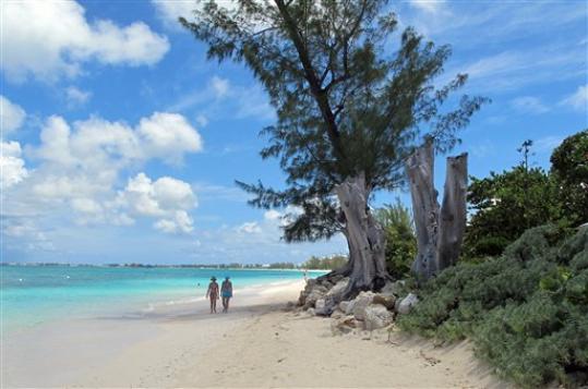 Cayman to Raise Tourist Taxes, Work Permit Fees