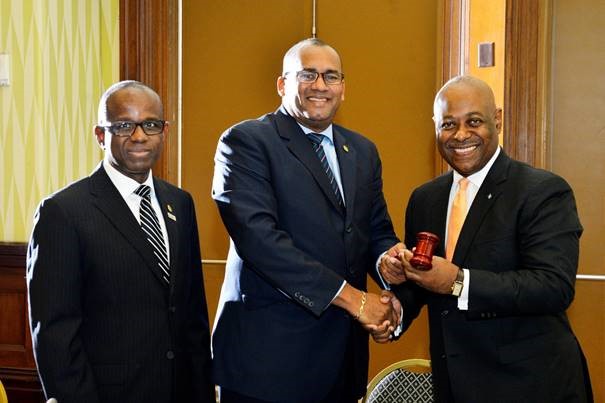New CTO Chairman Obie Wilchcombe of the Bahamas (right) receives the gavel from his predecessor Richard Sealy of Barbados. Also in photograph, CTO secretary general Hugh Riley (Right) The Bahamas Elected Chair of Caribbean Tourism Organization
