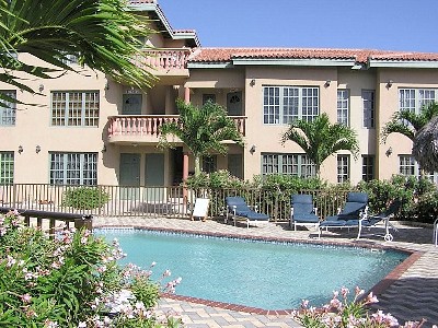 Palm Aruba Condominiums Signs with Interval International
